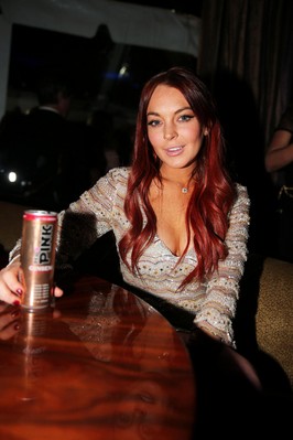 Lindsay Lohan enjoys a Mr. Pink Ginseng Drink at the launch party inside of the Beverly Wilshire Hotel.