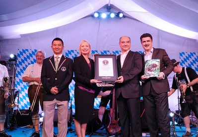 (From left to right) The Guinness World Records adjudicator presented the certificate to Sheraton Macao Hotel's General Manager of Sales &amp; Marketing Ms. Ruth Boston together with Mr. Manuel Gon&ccedil;alves Pires Junior, Deputy Director of Macau Government Tourist Office and General Manager of Operations Mr. Kai Petry, to officially recognized Sheraton Macao Hotel has set a new Guinness World Records for Most people opening bottles in a relay.